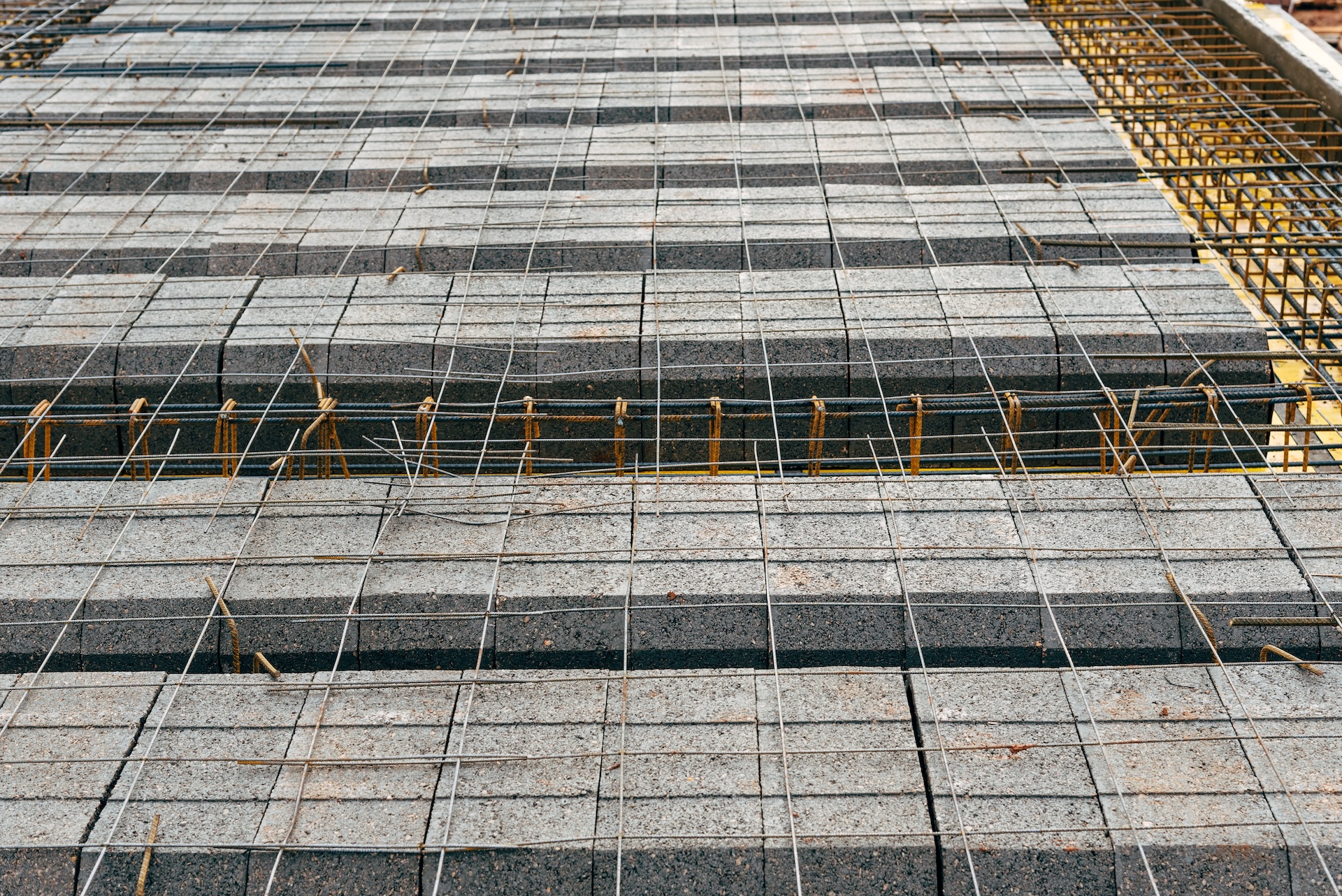 Rebar and wire mesh reinforcement laid out for a concrete slab in Archer, Florida