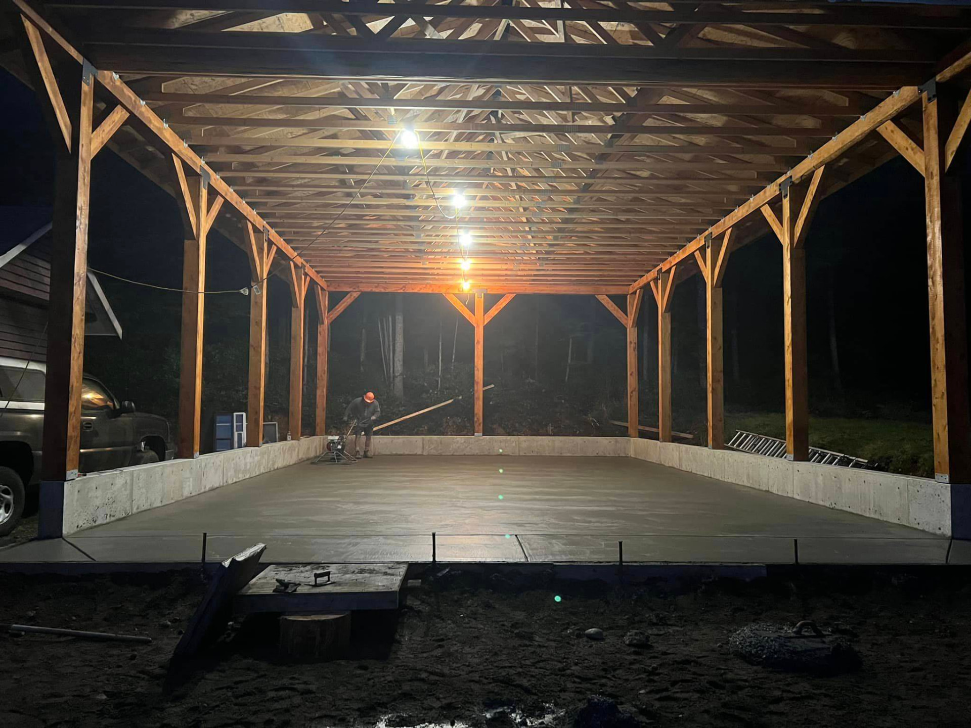 Freshly finished pole barn concrete slab at night in Bell, Florida