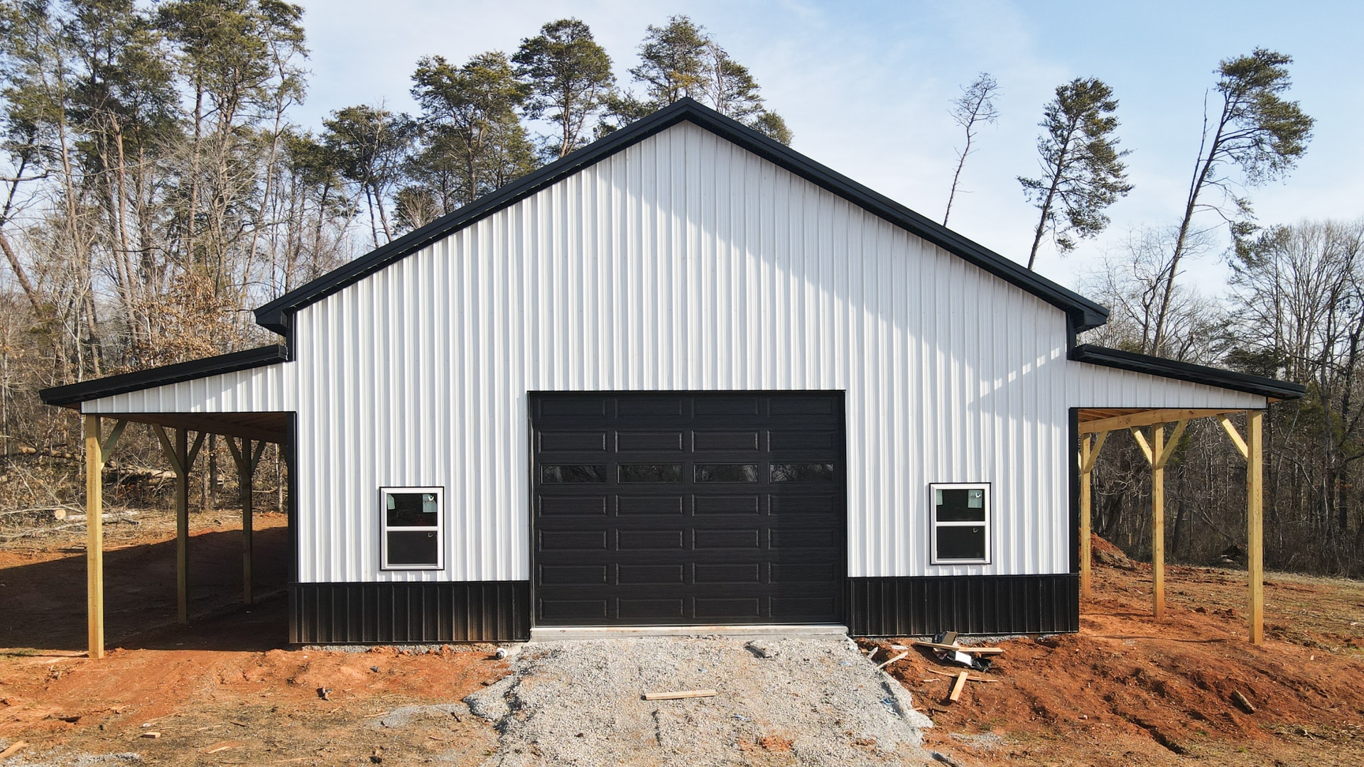 Completed pole barn with concrete slab and entry apron in Chiefland, Florida