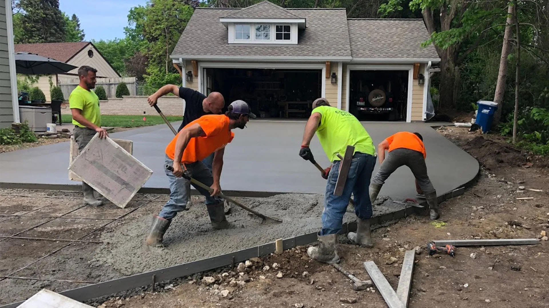 Gator Concrete crew floating and edging a fresh driveway pour in North Central Florida