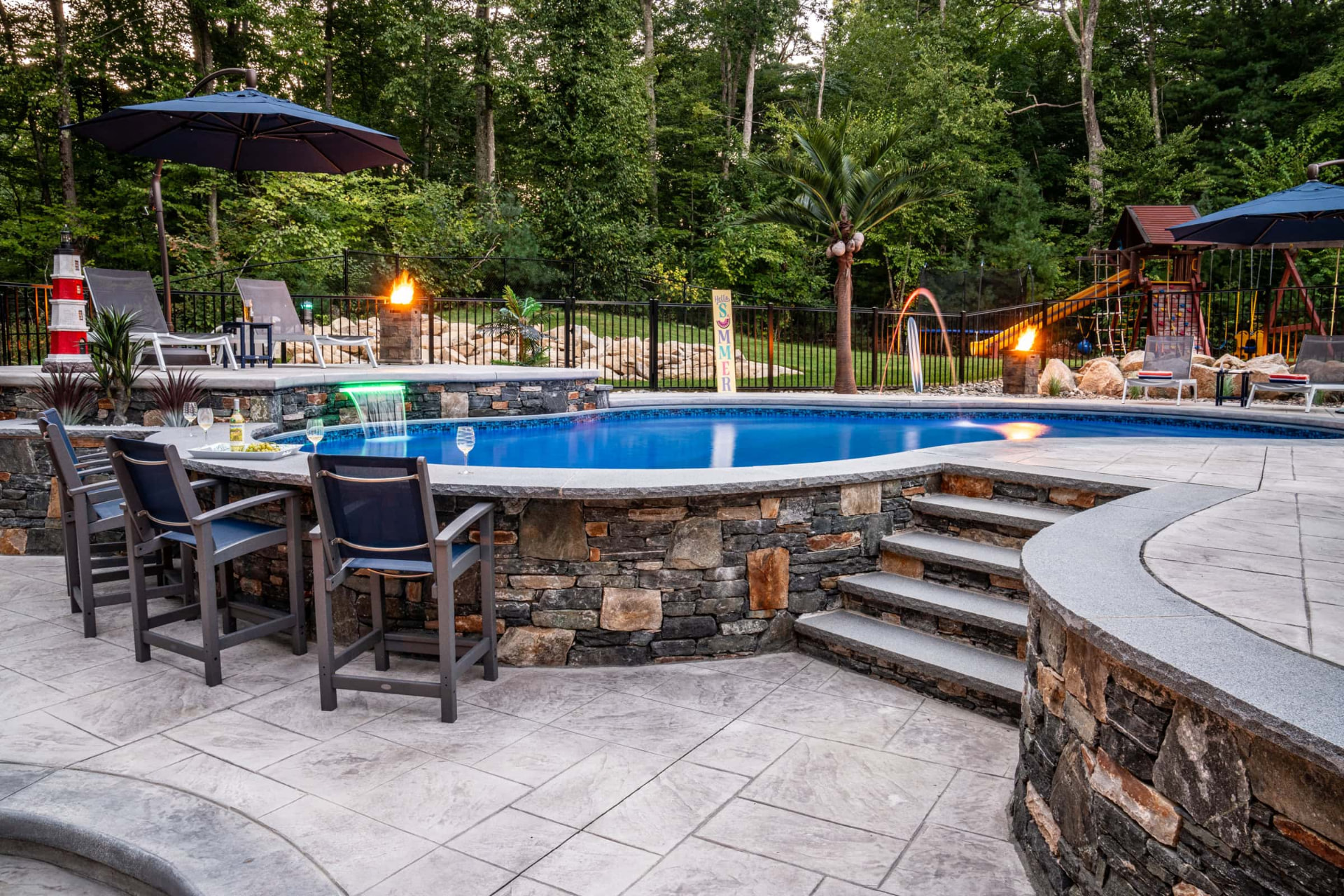Stamped concrete pool deck with raised bar patio in Newberry, Florida