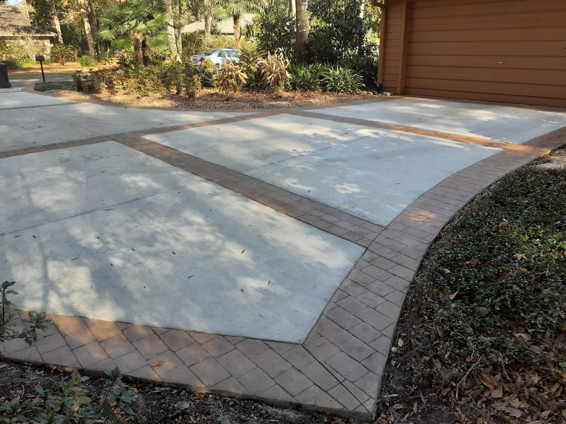 Concrete driveway with stamped brick banding and border in Micanopy, Florida