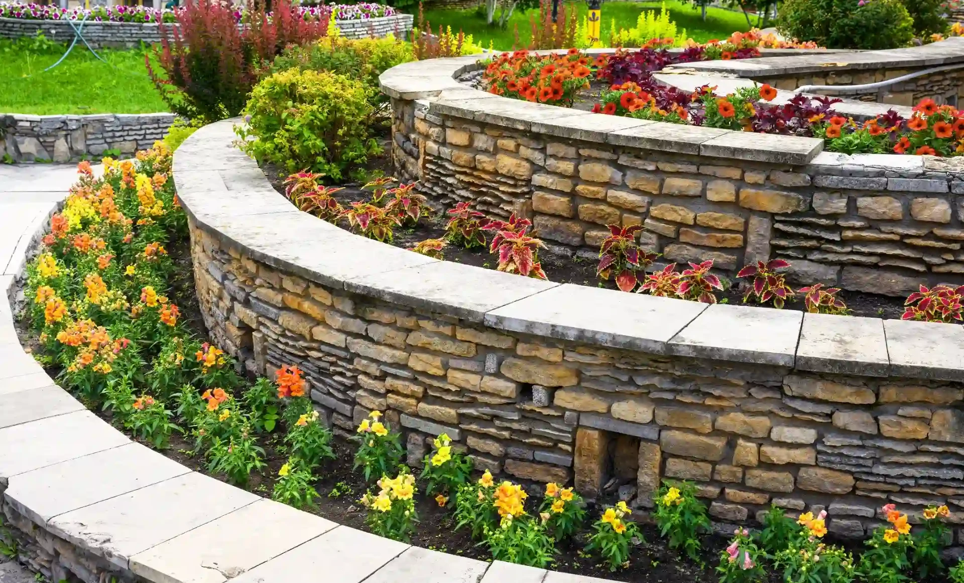 Retaining wall with concrete caps and border path in Chiefland, Florida