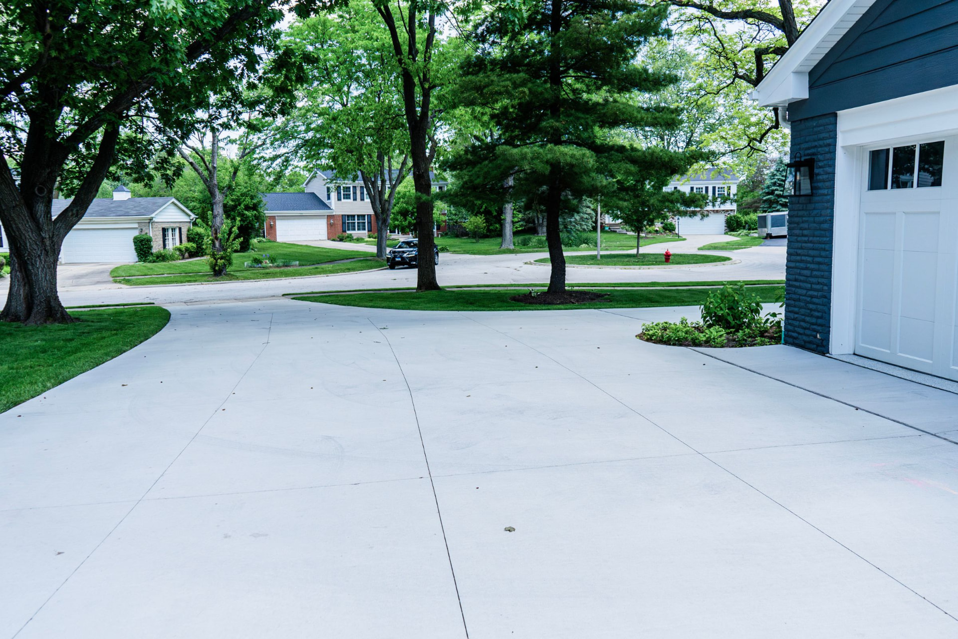 Replaced concrete driveway beside a garage in Marion County, Florida