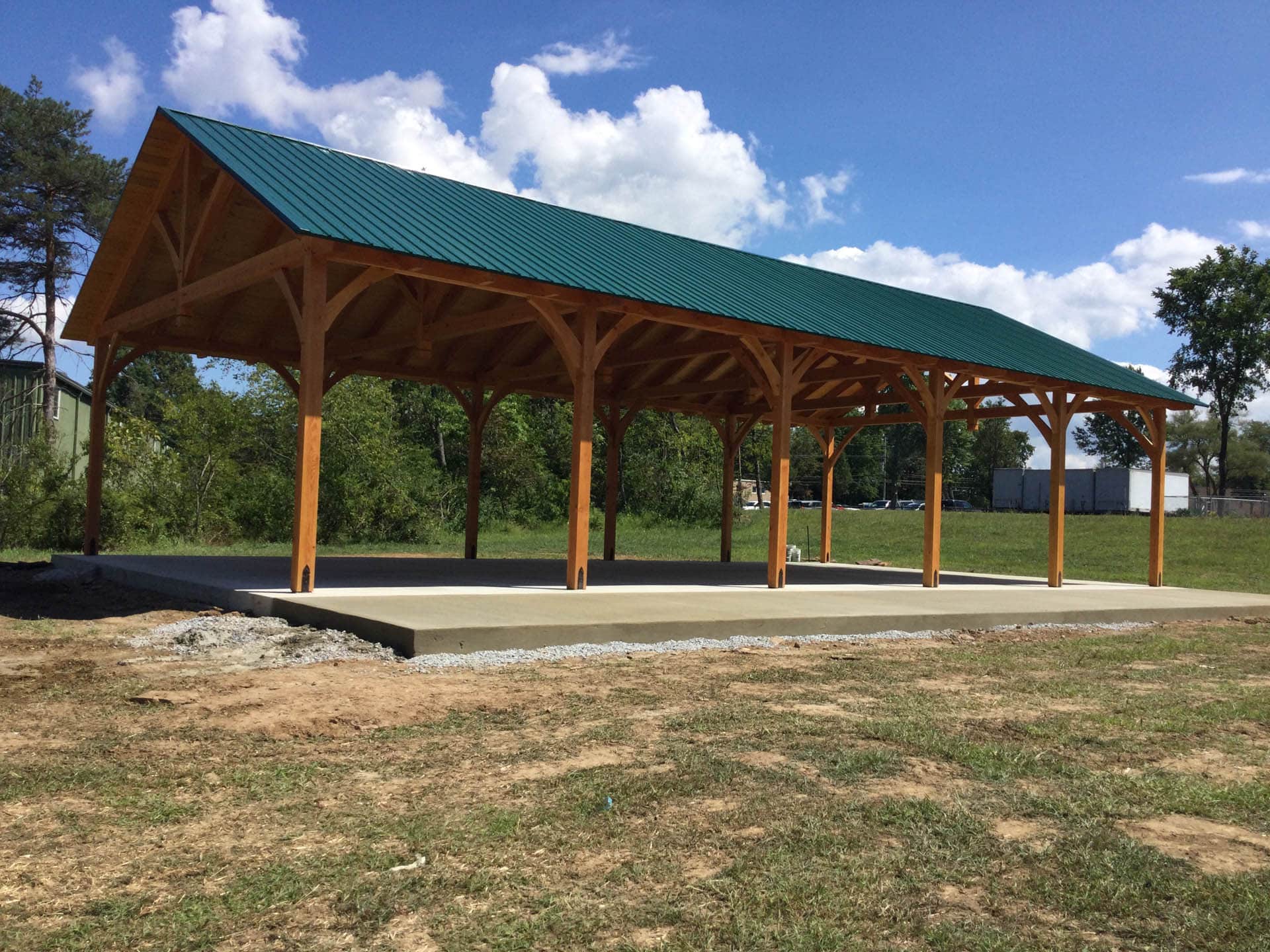Finished concrete pavilion slab under a timber frame in Hawthorne, Florida
