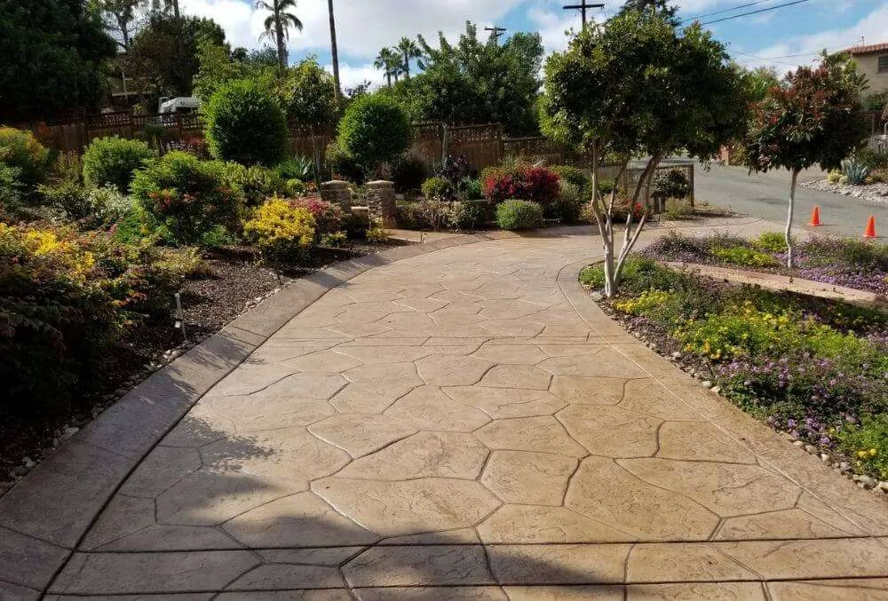 Geometric patterned stamped concrete driveway
