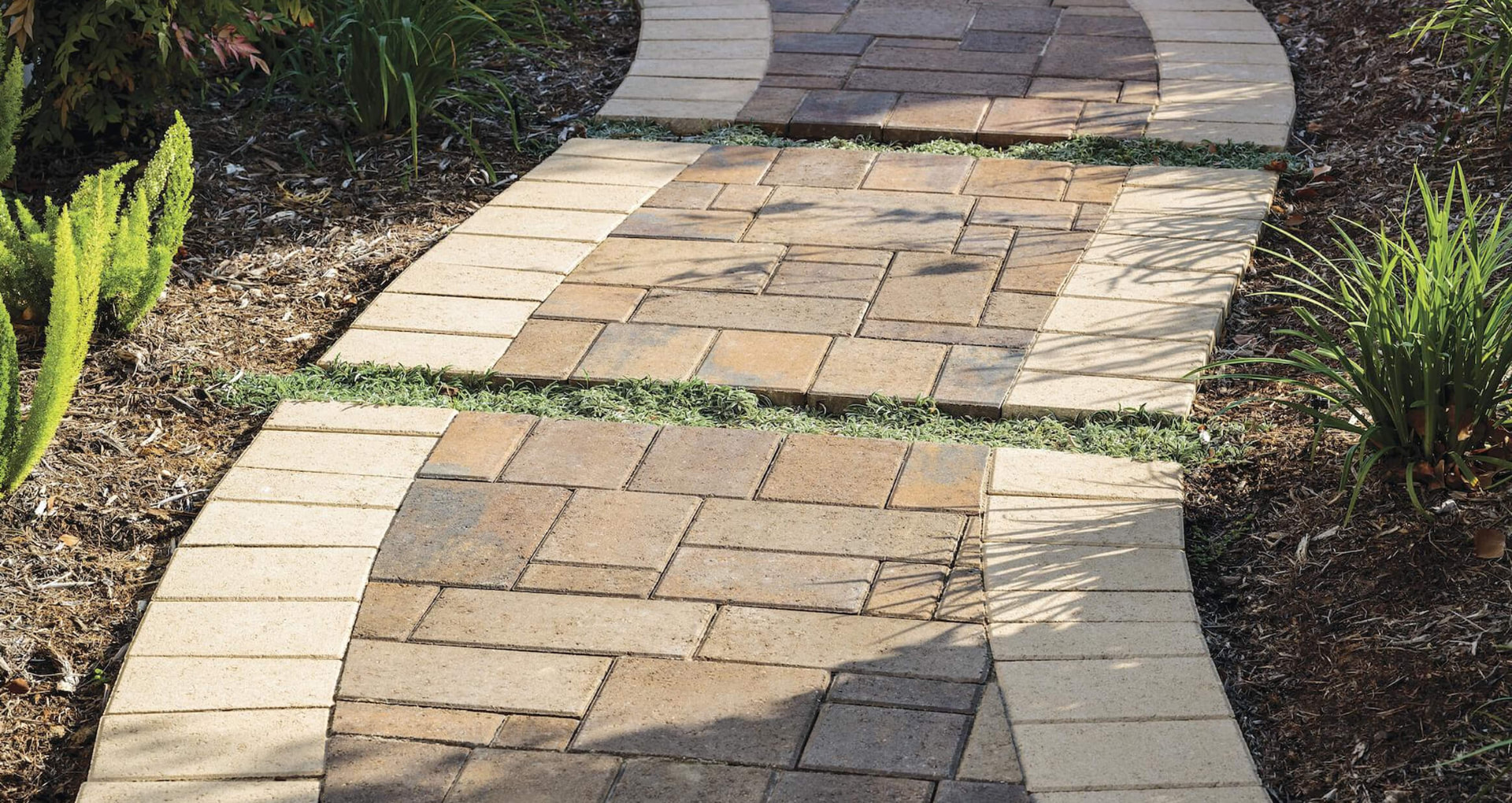 Banded paver walkway with grass joints in Williston, Florida