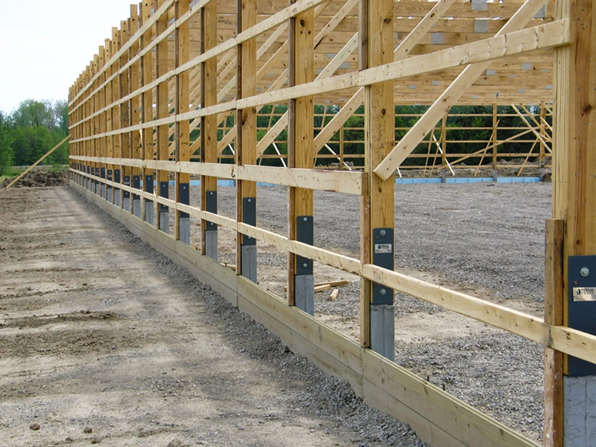Concrete pier foundations supporting a pole barn post frame in Trenton, Florida